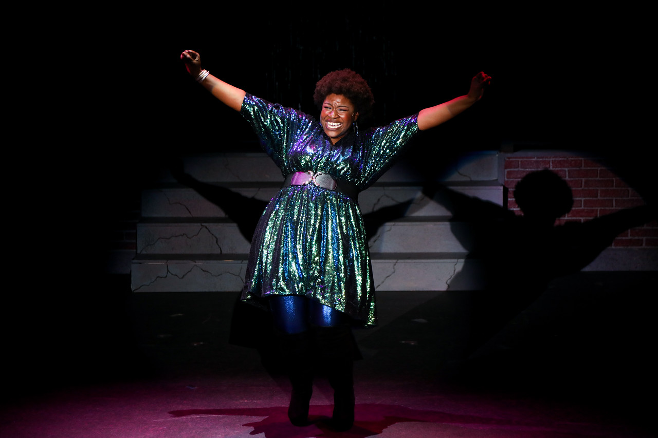 Excited woman with hands in the air