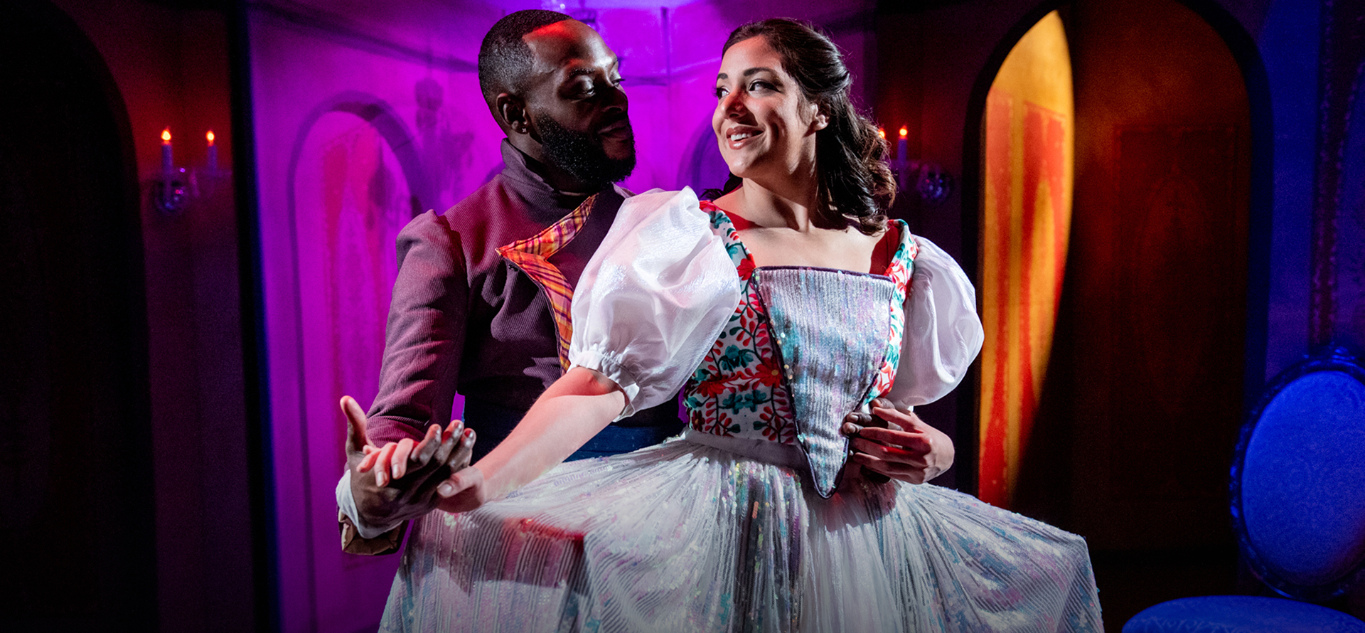 A man and a woman on stage in a play