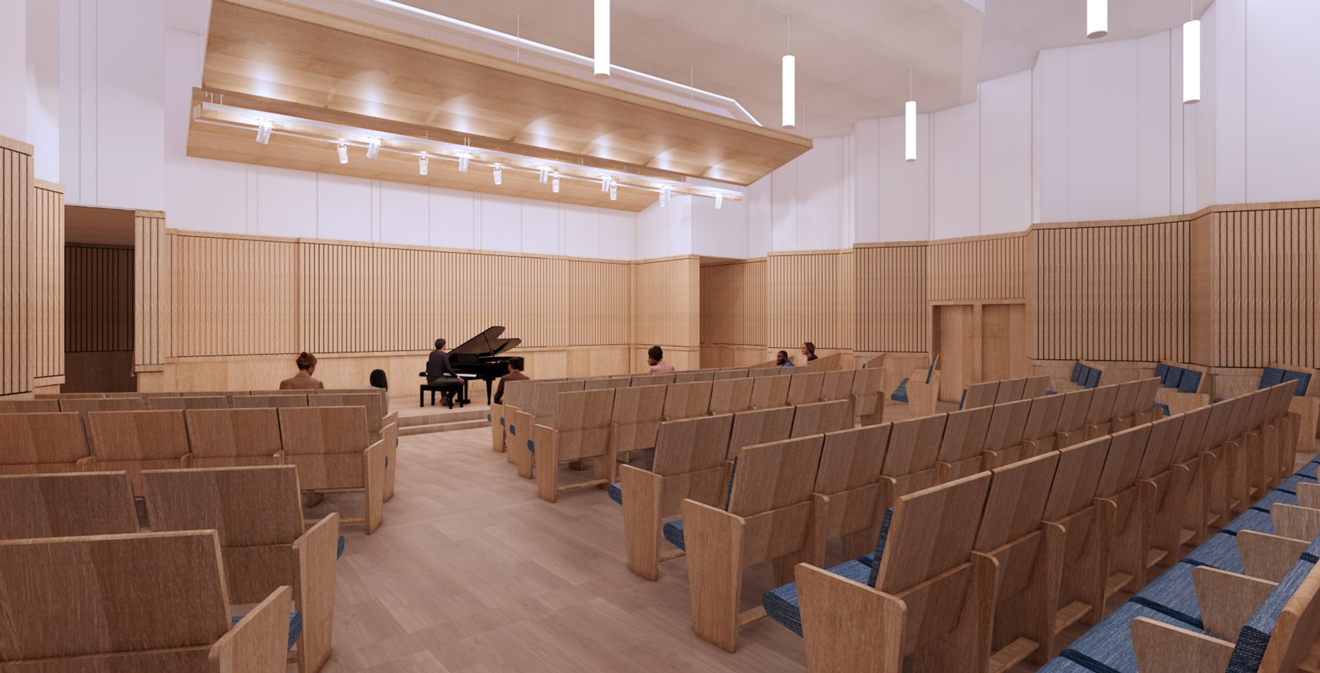 Interior view of the Wallach Building at 太阳城娱乐 showing a spacious room with a piano on an elevated stage