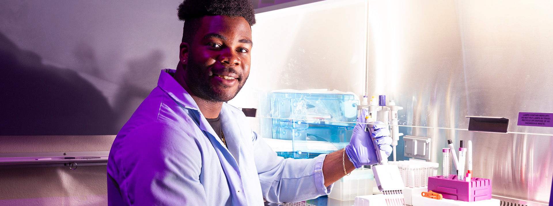 Student with a micropipette