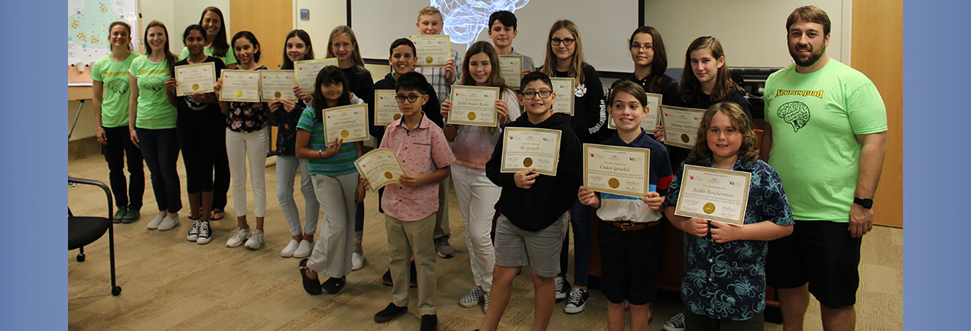 Students standing with certificates