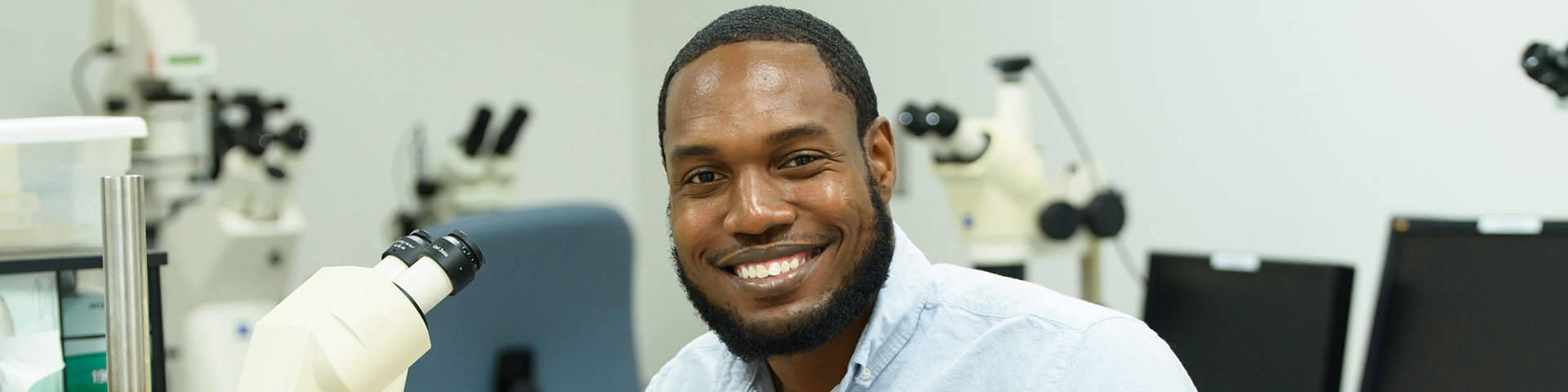 Sean working at his microscope in the lab