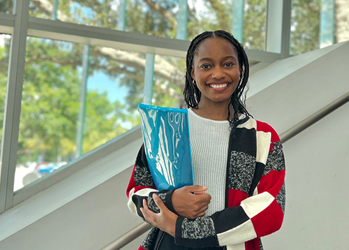 students chatting and smiling in robotics lab