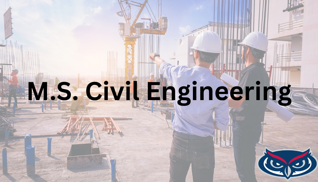 Engineers at construction site reviewing plans together