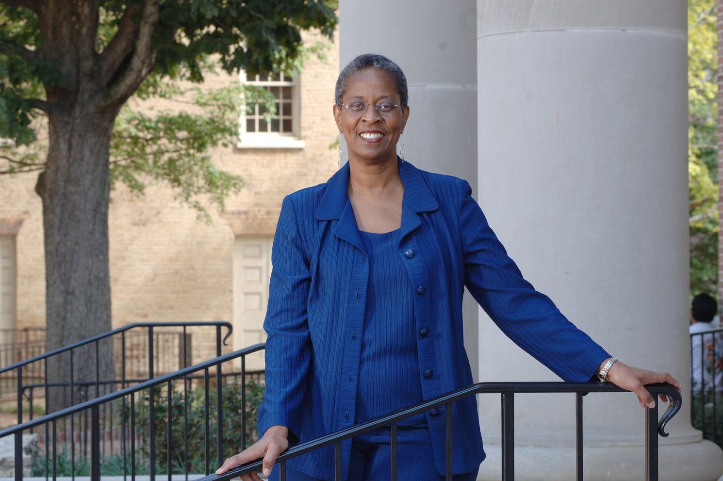 Trudier Harris standing in a blue suit.