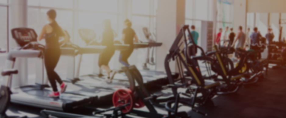 Female student looking and three students sitting in the background