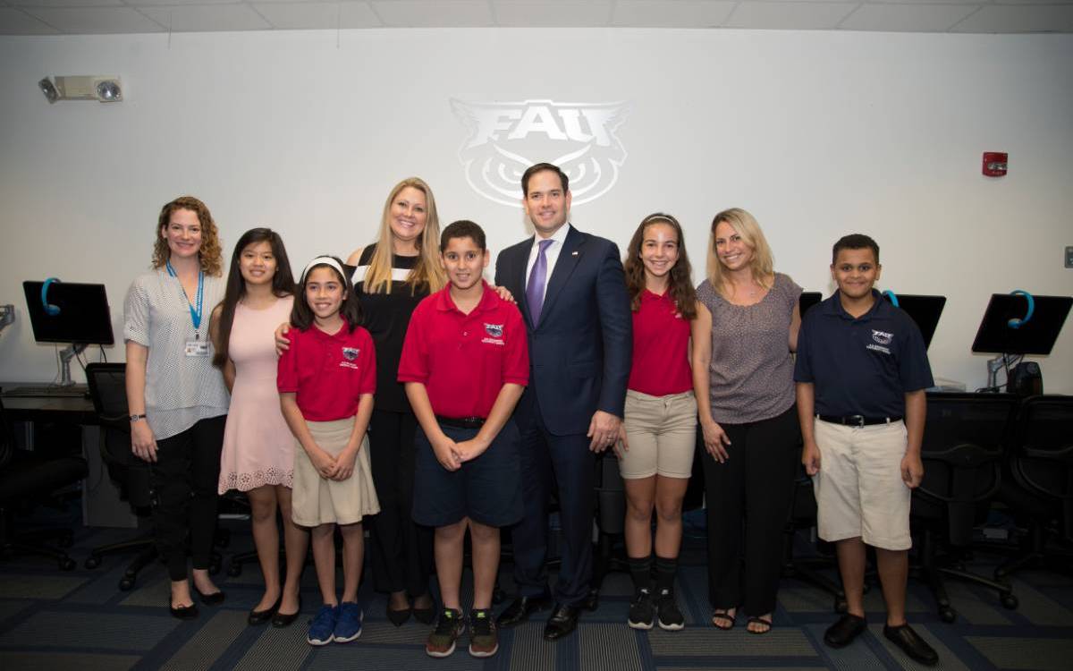 Students and Faculty and Administrators posing in a group