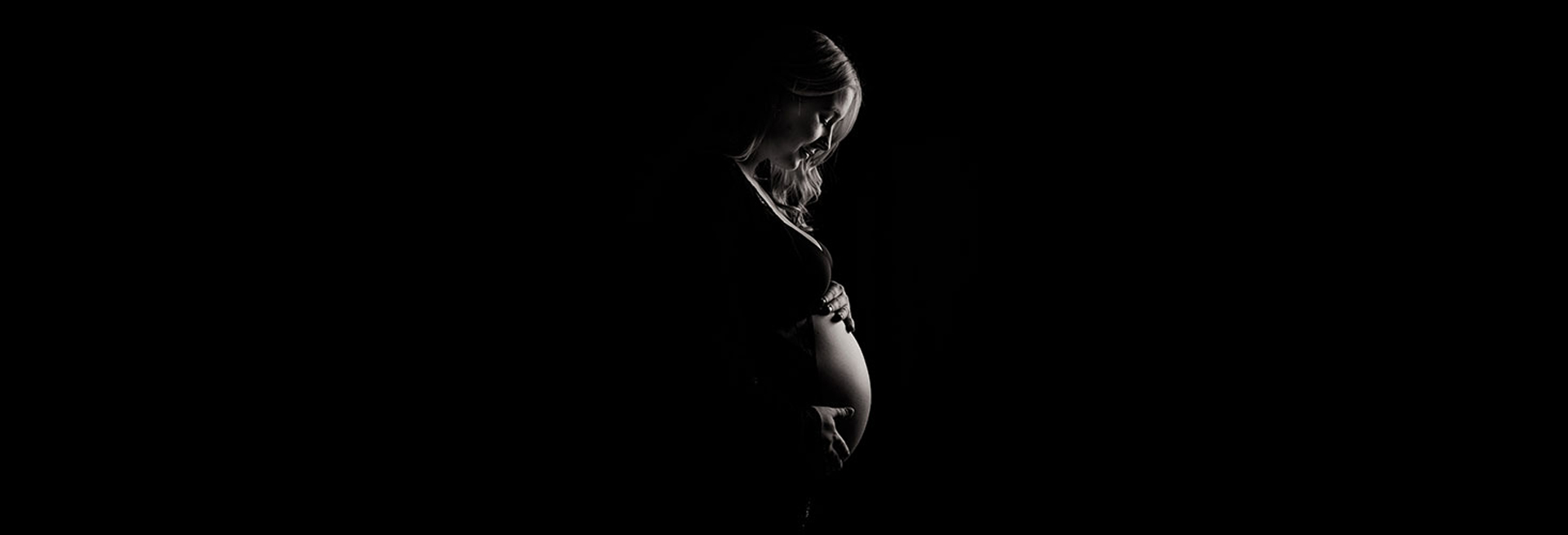 black and white image of pregnant woman