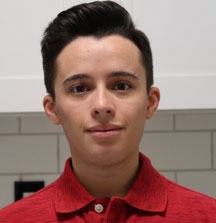 Headshot photo of Maxwell von Werder, a twenty-something Caucasian male wearing a red button up shirt.